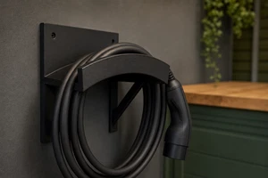 Wall-mounted EV charging cable holder